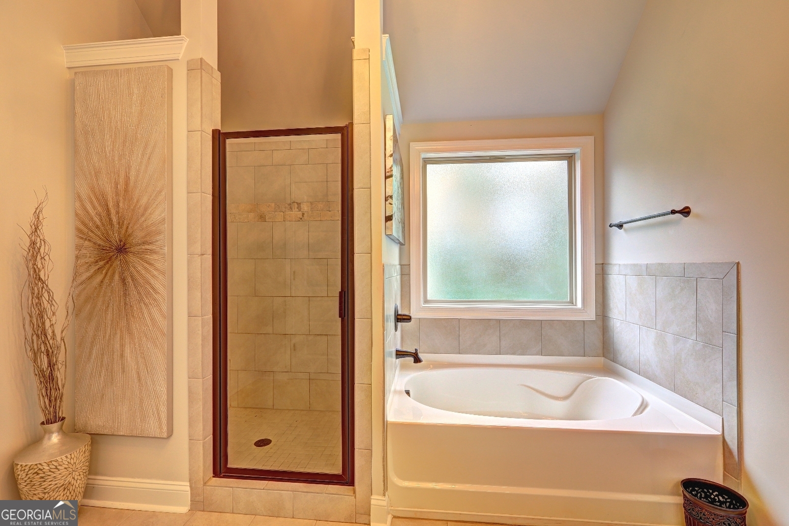269 Baumgard Way Locust Grove, GA 30248 - Photo 20 of 23 a bathroom with a bathtub and a shower