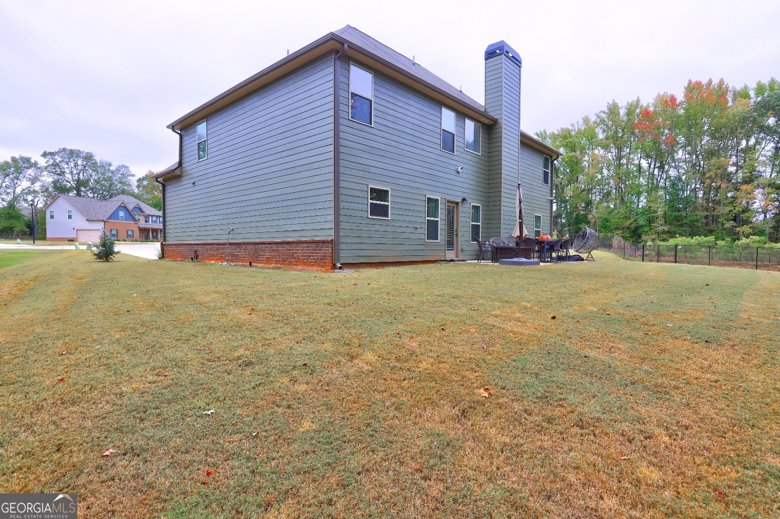 269 Baumgard Way Locust Grove, GA 30248 - Photo 22 of 23 a view of a house with a yard and garage