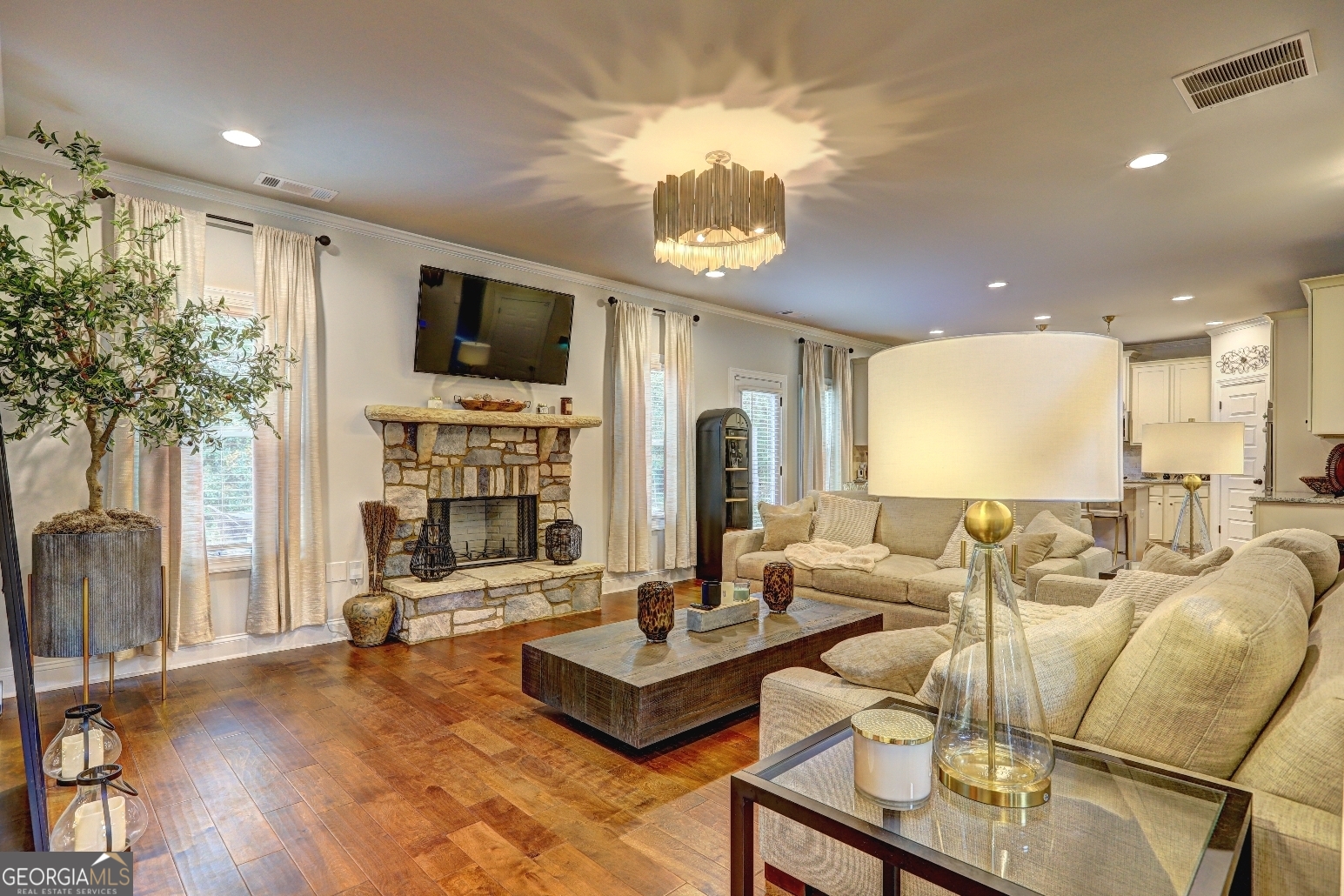 269 Baumgard Way Locust Grove, GA 30248 - Photo 3 of 23 a living room with fireplace furniture and a flat screen tv