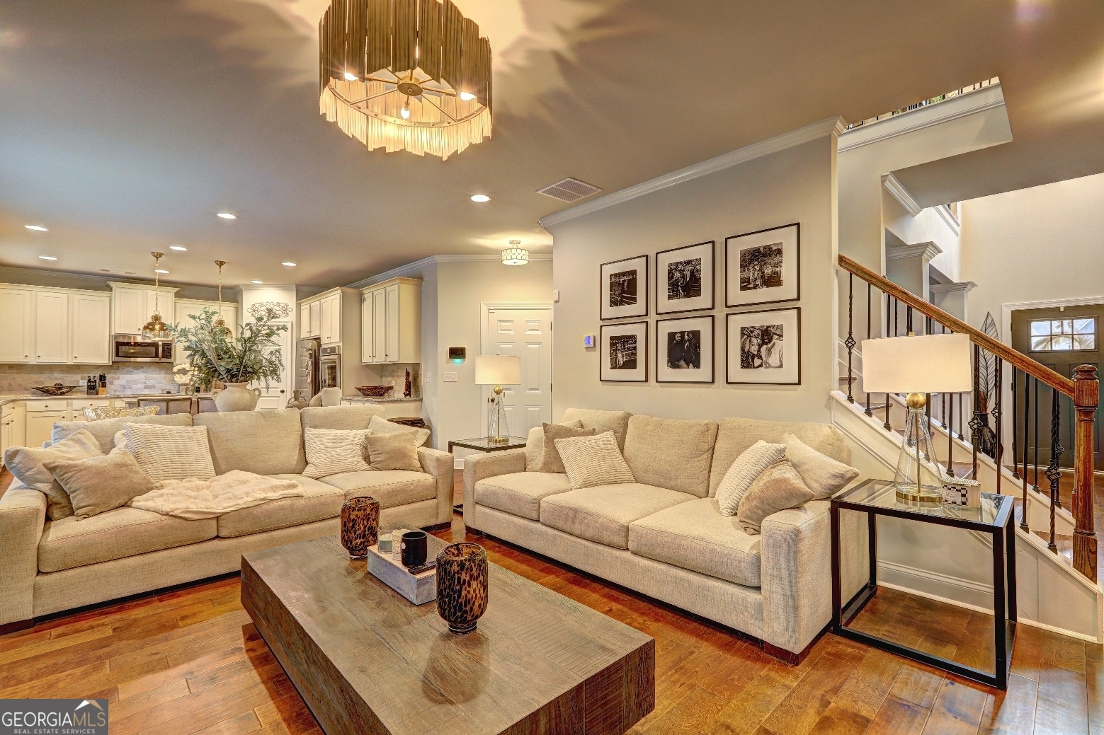 269 Baumgard Way Locust Grove, GA 30248 - Photo 4 of 23 a living room with furniture kitchen view and a chandelier