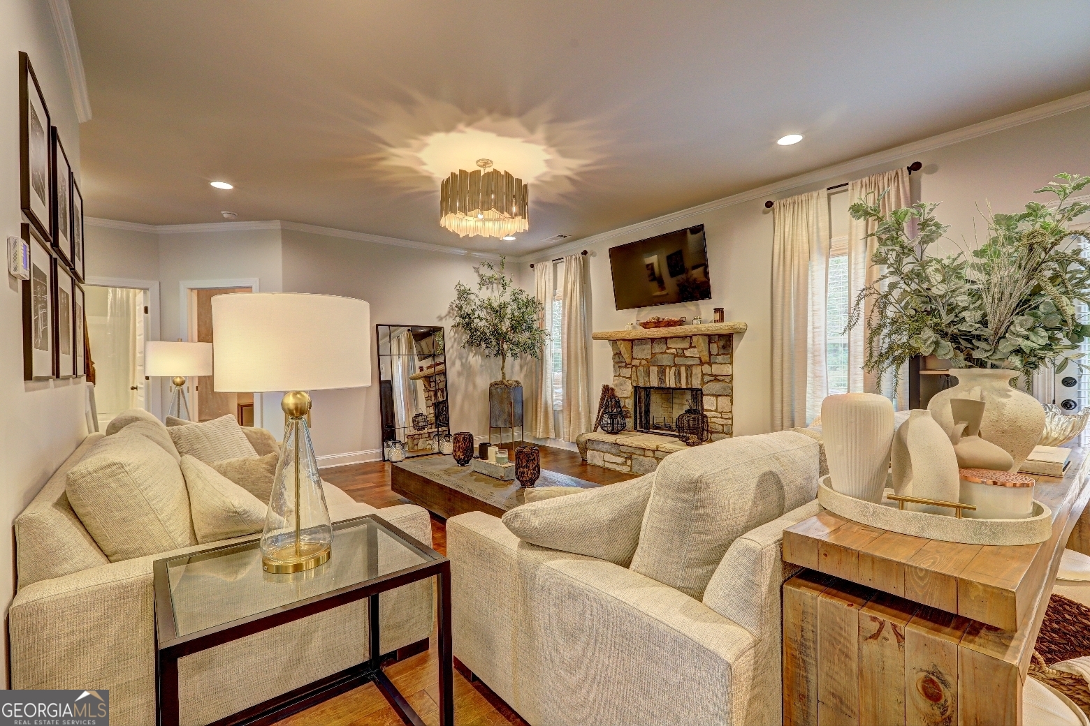 269 Baumgard Way Locust Grove, GA 30248 - Photo 5 of 23 a living room with fireplace furniture and a flat screen tv
