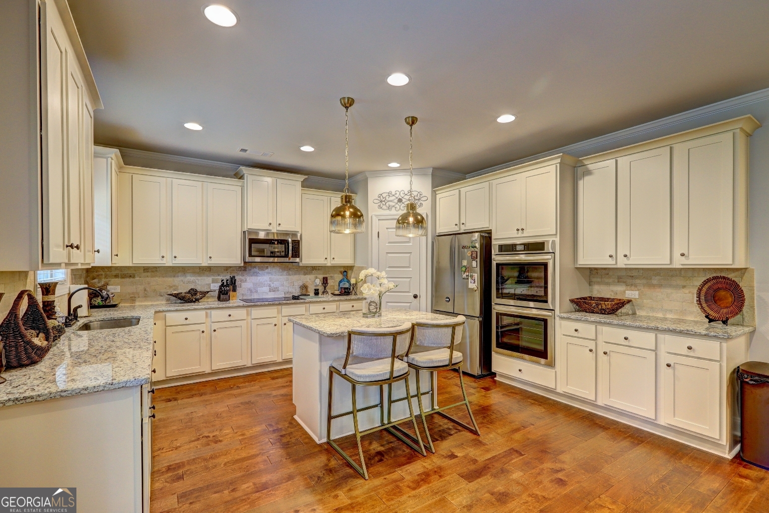269 Baumgard Way Locust Grove, GA 30248 - Photo 7 of 23 a kitchen with stainless steel appliances granite countertop a sink stove and refrigerator