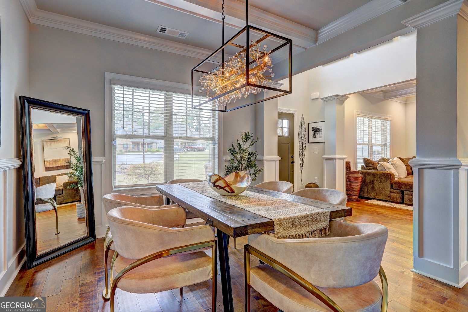 269 Baumgard Way Locust Grove, GA 30248 - Photo 8 of 23 a view of a dining room with furniture wooden floor and a chandelier
