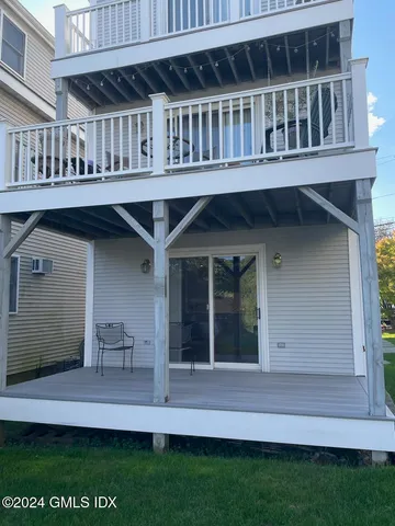 a view of front door of house with a yard