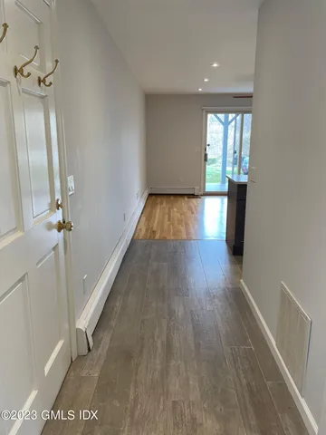 a view of gallery with wooden floor