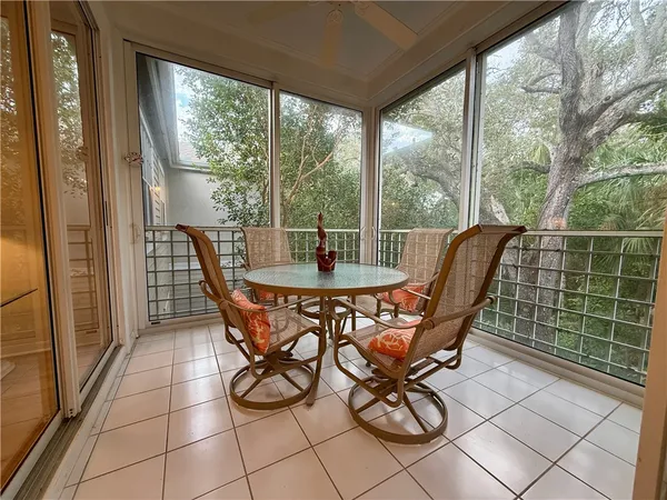 a dining room with furniture and outdoor space