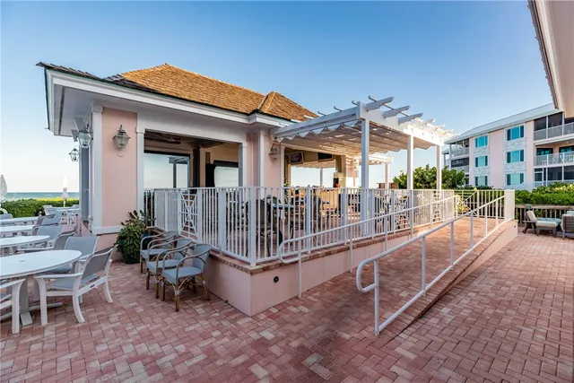 a view of a house with backyard porch and sitting area