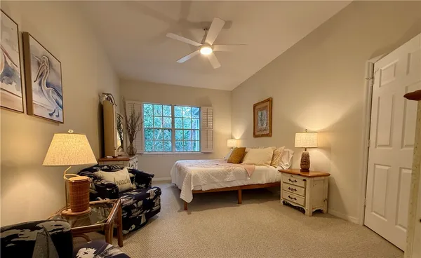 a bedroom with bed and a window