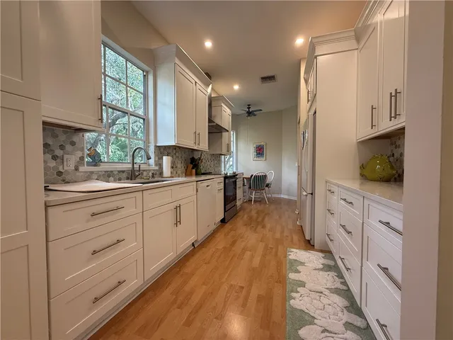 a large kitchen with cabinets