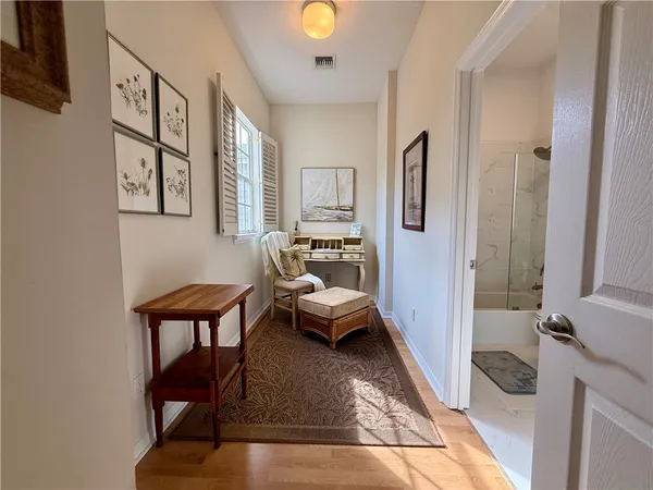 a living room with furniture and a rug