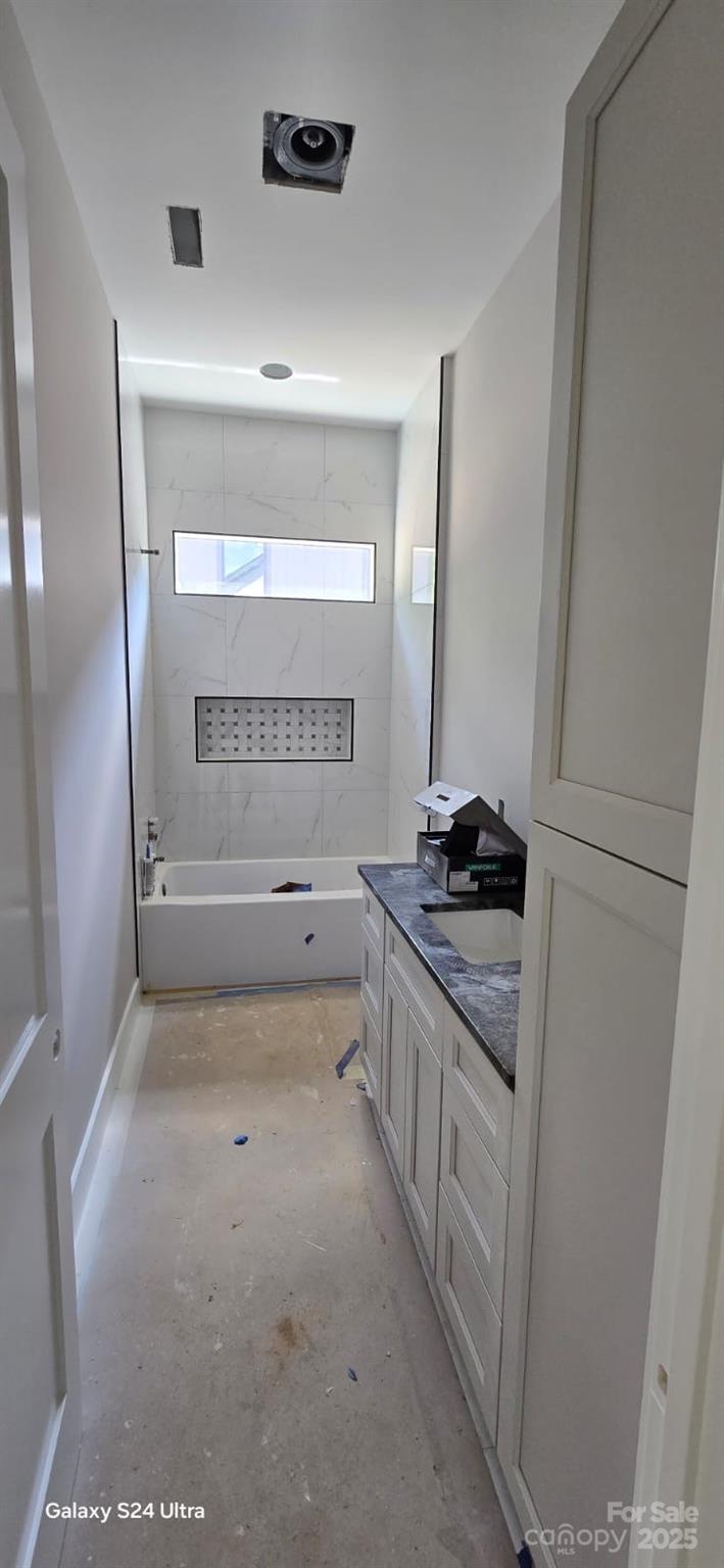 23 George Allen Ridge Arden, NC 28704 - Photo 2 of 7 a bathroom with a granite countertop sink and a mirror
