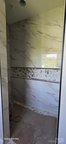 a living room with a bed and furniture