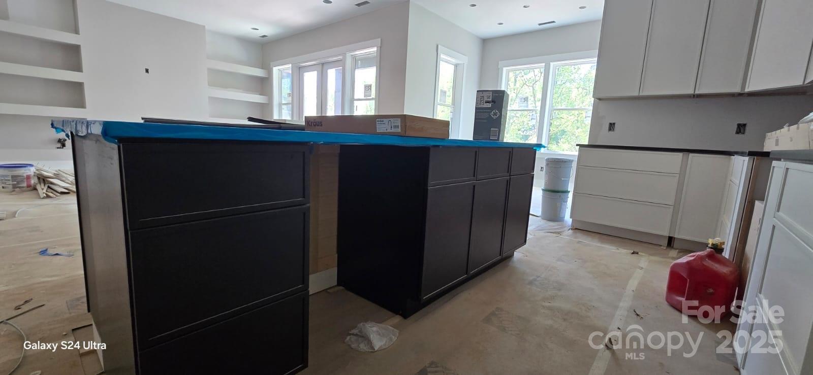 23 George Allen Ridge Arden, NC 28704 - Photo 5 of 7 a kitchen with a sink and cabinets
