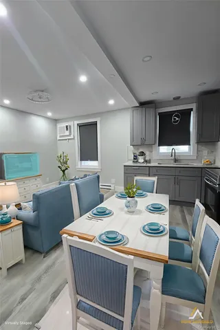 a view of a dining room with furniture