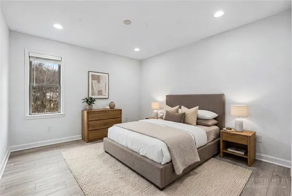 a bedroom with a bed and a window