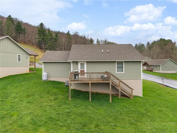 a view of a house with a backyard