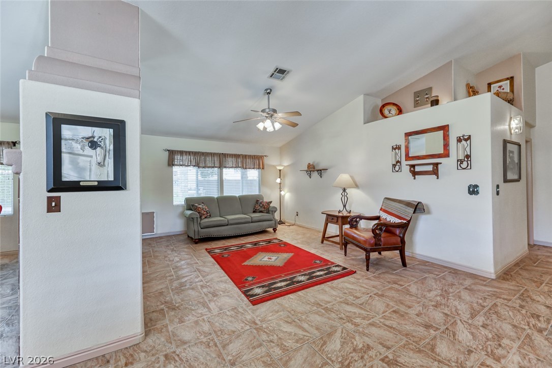 2001 Appaloosa Road Henderson, NV 89002 - Photo 18 of 44 This inviting living space features high vaulted ceilings and durable tile flooring, perfect for comfortable living.