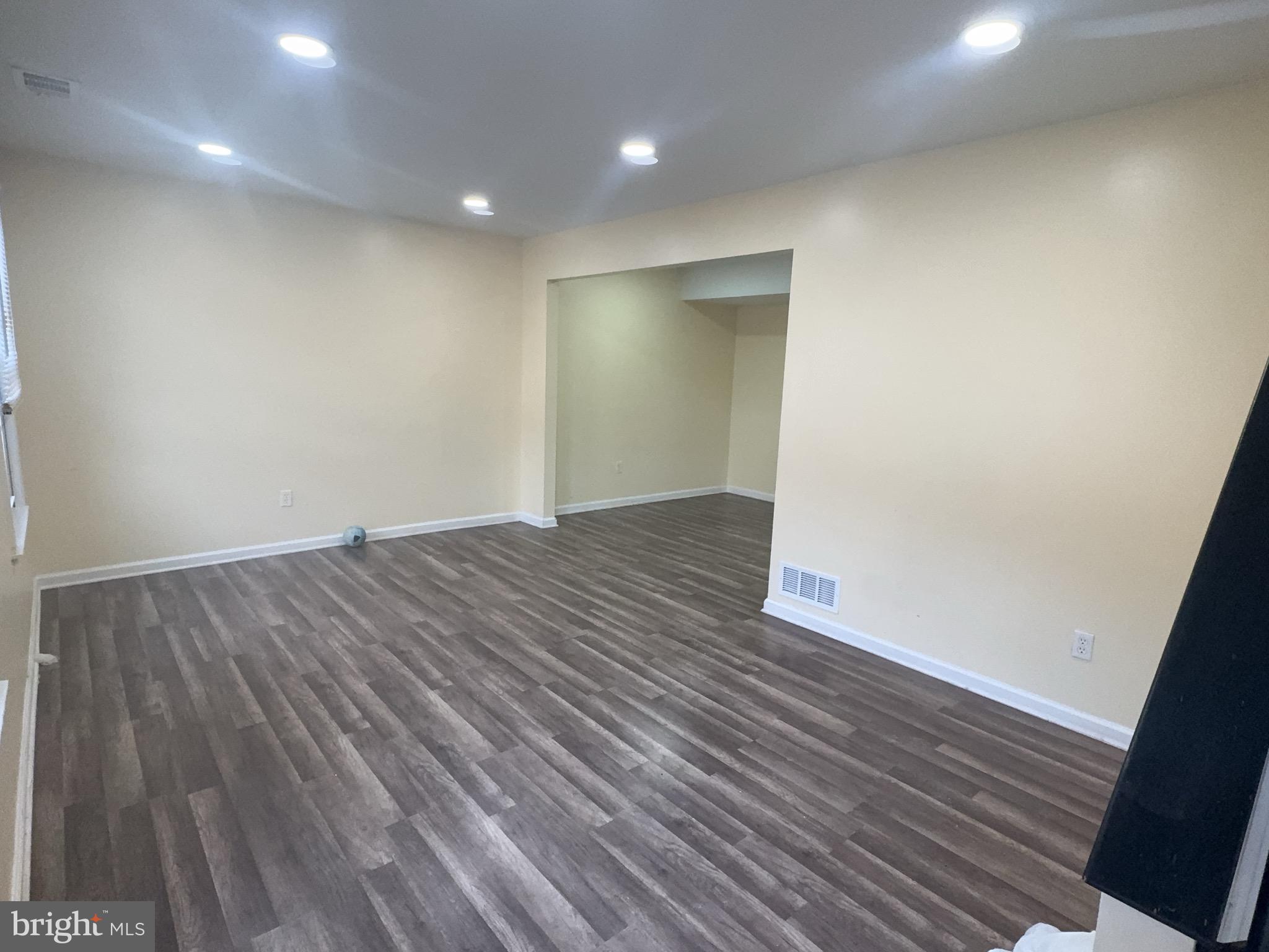 13008 Townsend Road, Unit L3 Philadelphia, PA 19154 - Photo 4 of 14 wooden floor in an empty room with wooden floor