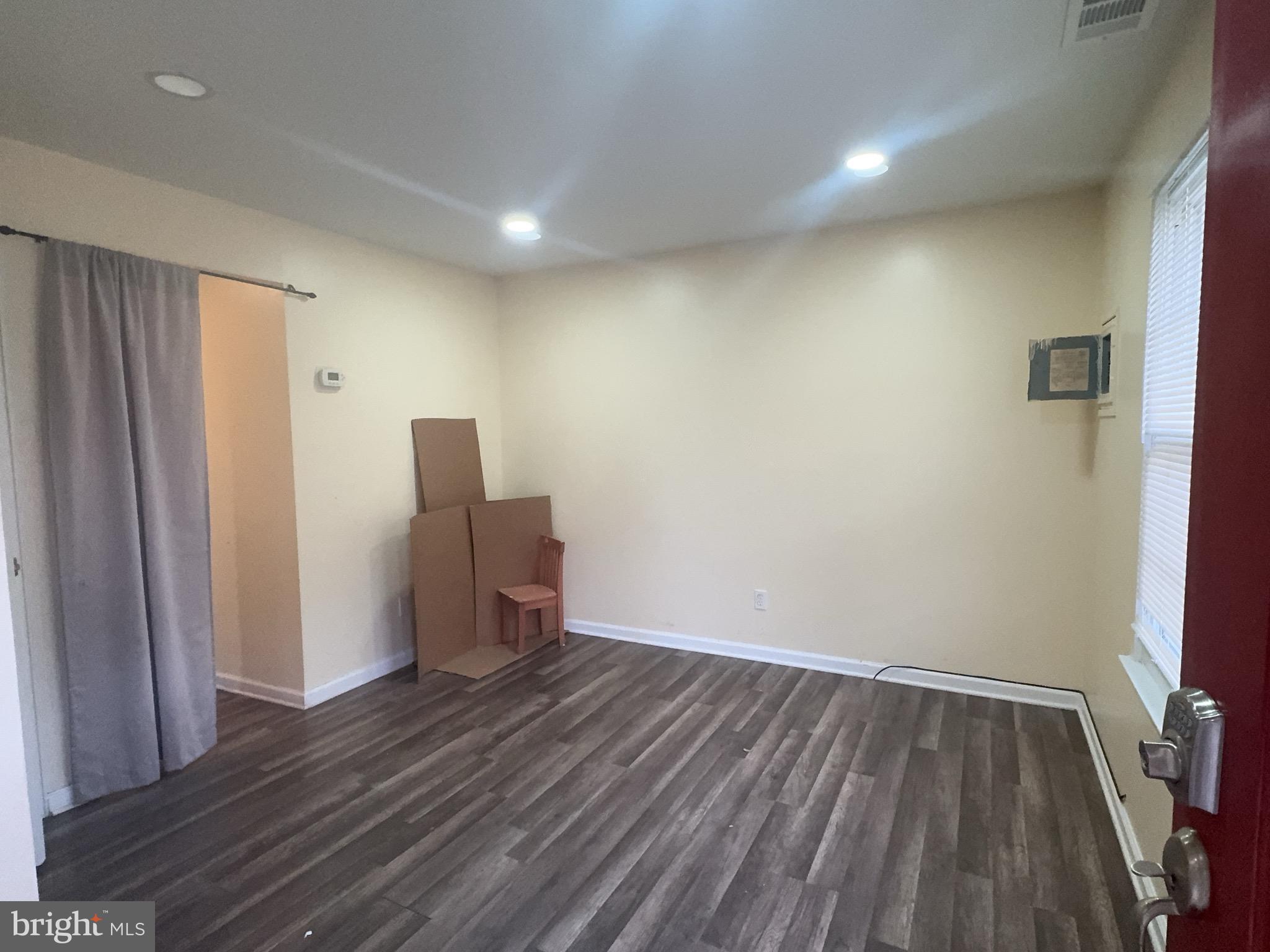 13008 Townsend Road, Unit L3 Philadelphia, PA 19154 - Photo 5 of 14 a view of wooden floor and windows in a room