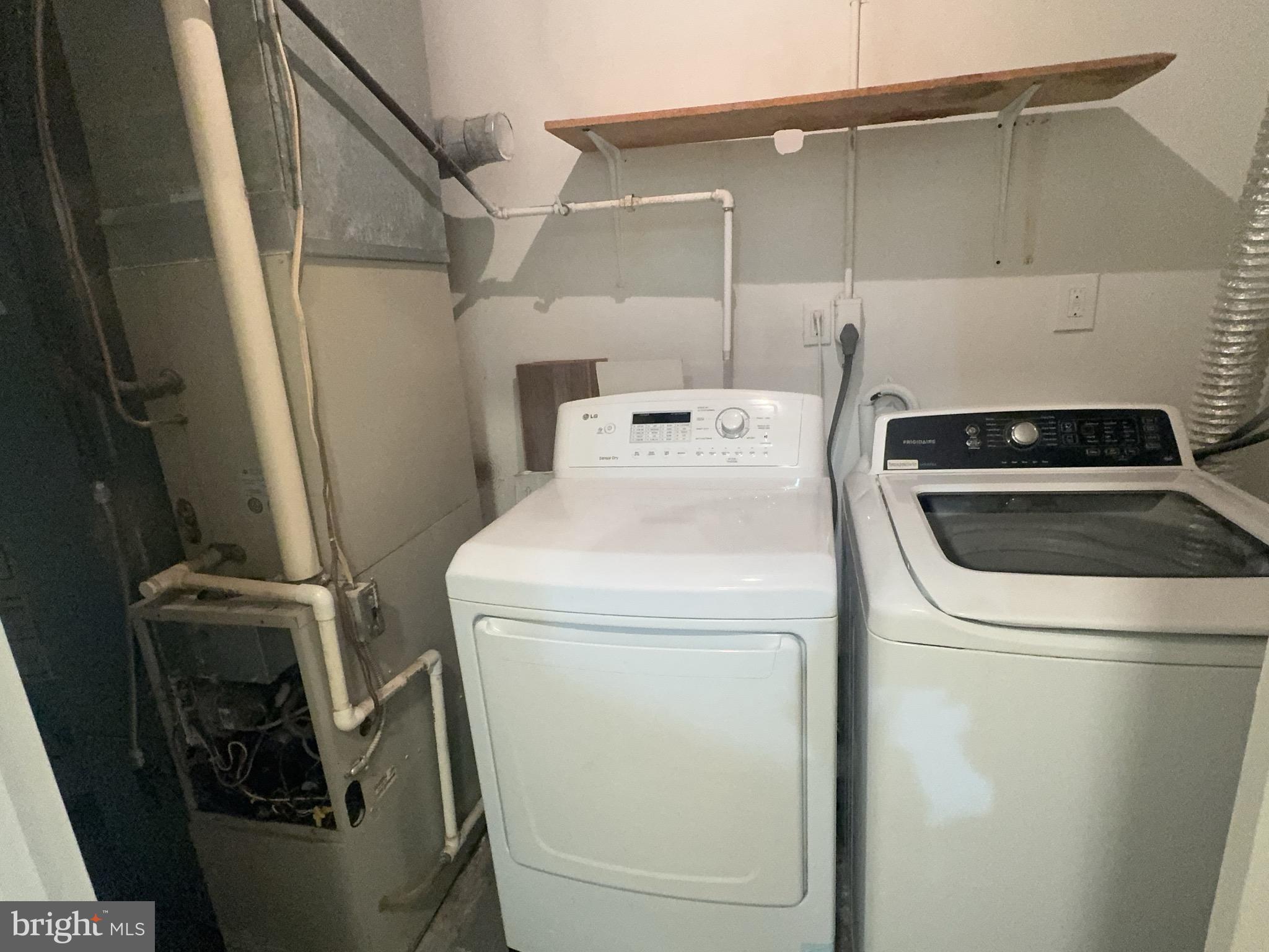 13008 Townsend Road, Unit L3 Philadelphia, PA 19154 - Photo 7 of 14 a utility room with dryer and washer