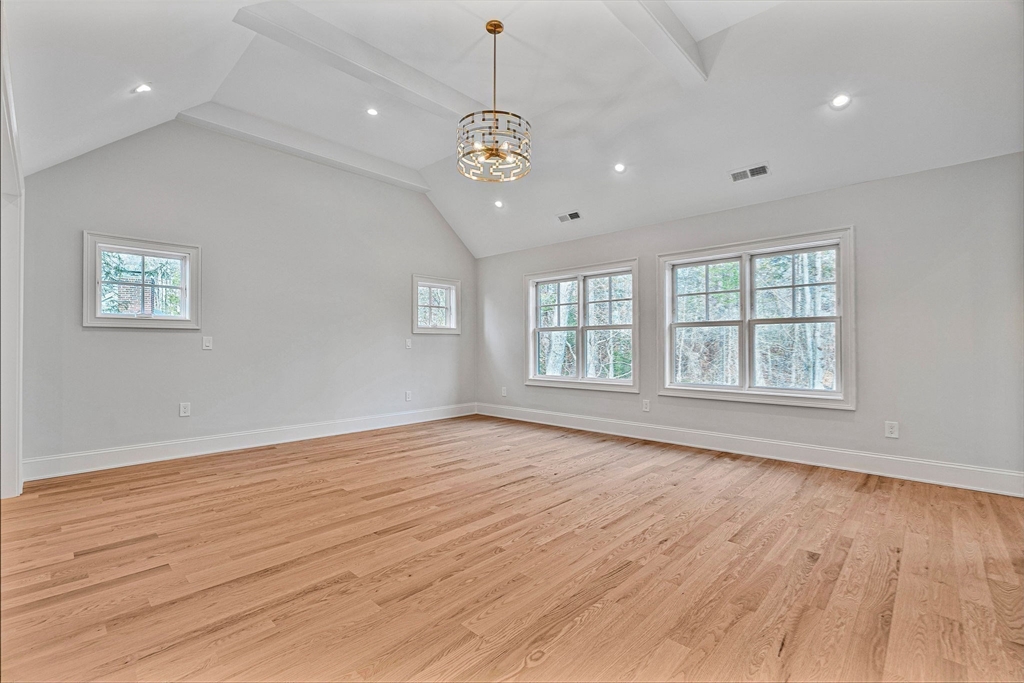 30 Hobart Road Wellesley, MA 02482 - Photo 18 of 40 a view of an empty room with wooden floor and a window