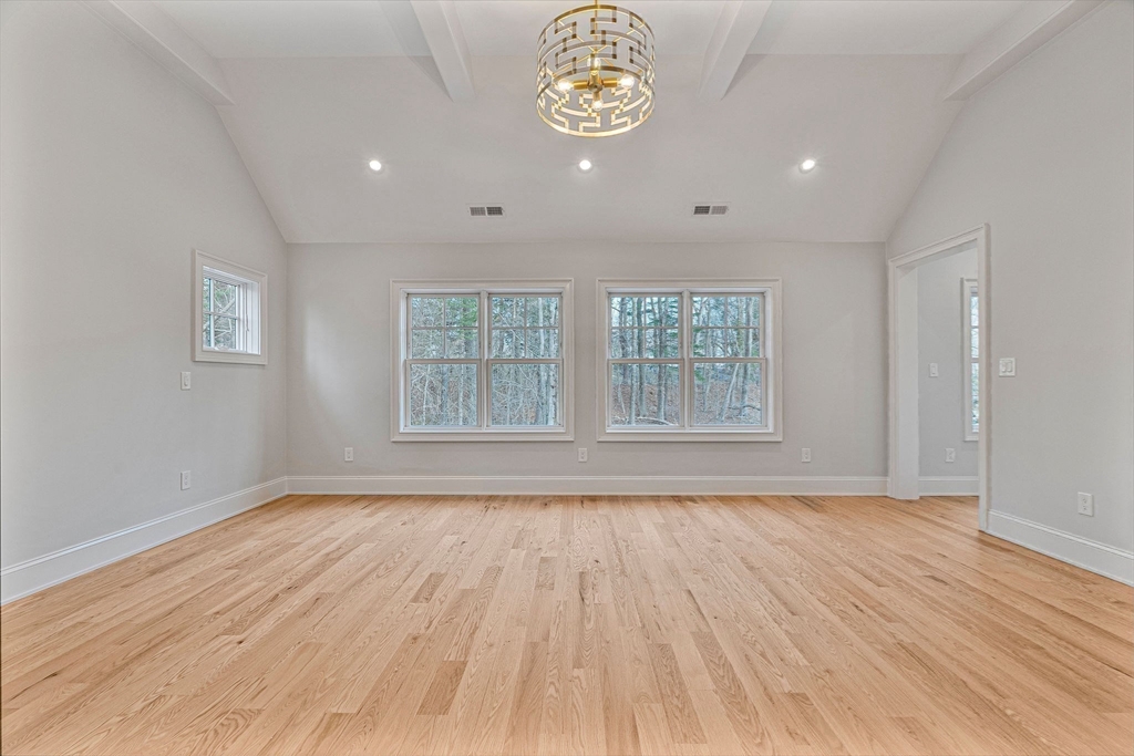 30 Hobart Road Wellesley, MA 02482 - Photo 19 of 40 a view of an empty room with a window and wooden floor