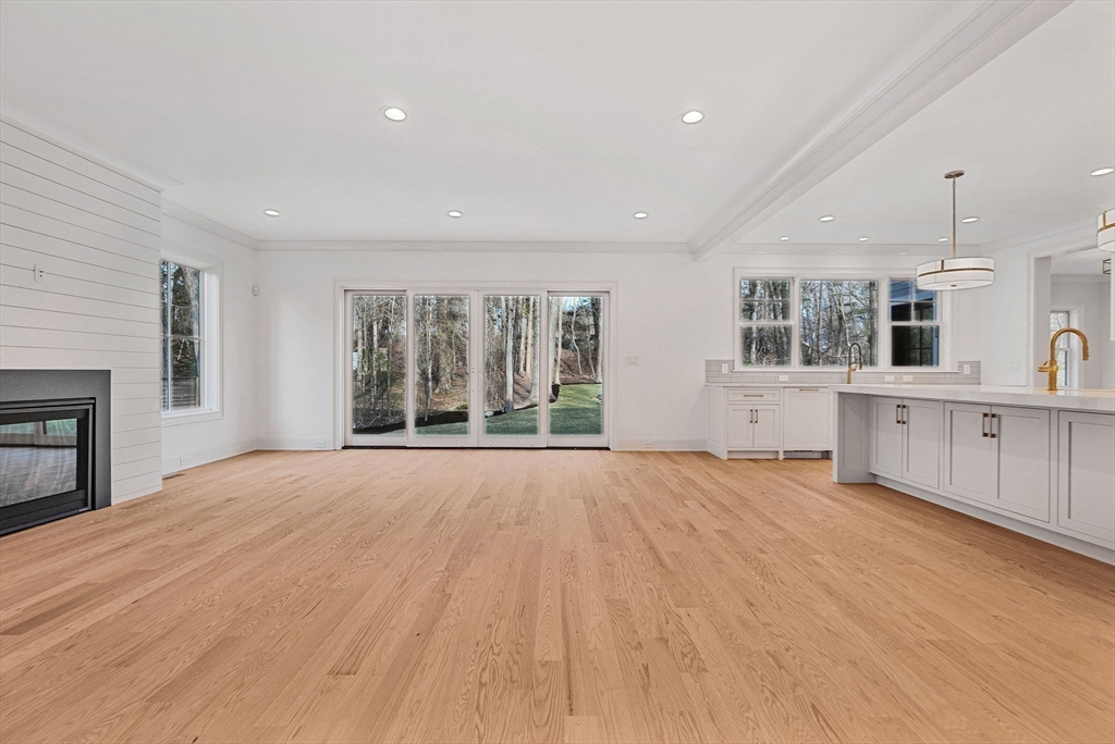 30 Hobart Road Wellesley, MA 02482 - Photo 23 of 40 a view of an empty room with a window and a kitchen