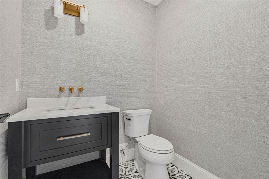 30 Hobart Road Wellesley, MA 02482 - Photo 34 of 40 a bathroom with a granite countertop toilet and sink