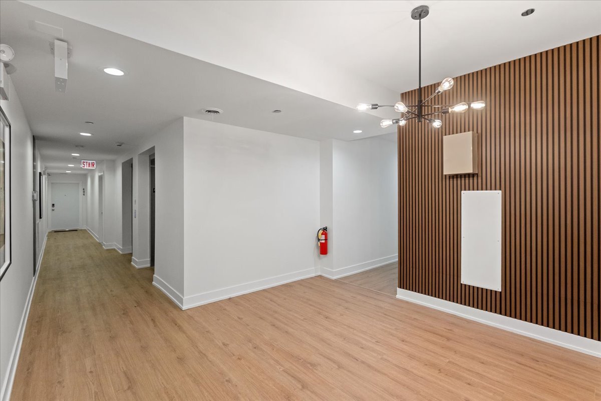 2217 West Madison Street, Unit 414 Chicago, IL 60612 - Photo 12 of 17 a view of an empty room with wooden floor