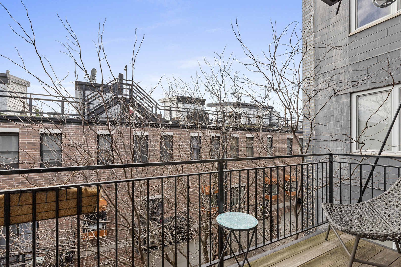 2217 West Madison Street, Unit 414 Chicago, IL 60612 - Photo 8 of 17 a view of a balcony that has two chairs and a table