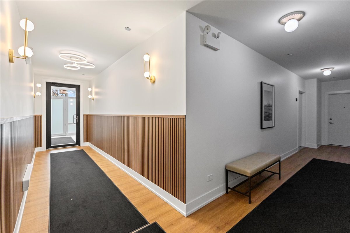 2217 West Madison Street, Unit 414 Chicago, IL 60612 - Photo 10 of 17 workspace with wooden floor and windows