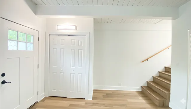 a view of a livingroom with wooden floor