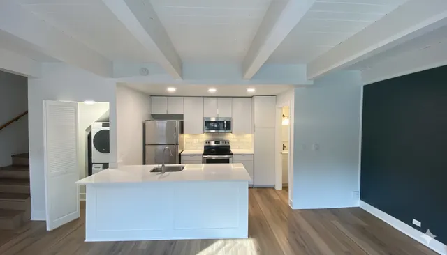 a view of kitchen with wooden floor