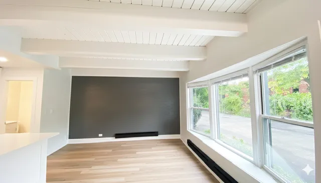 a view of an empty room with a window