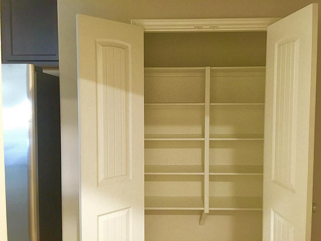 618 Longstreet Drive Rosenberg, TX 77469 - Photo 12 of 23 a view of a room with rack on the wall