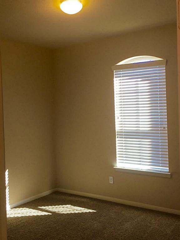 618 Longstreet Drive Rosenberg, TX 77469 - Photo 13 of 23 a view of a window in an empty room
