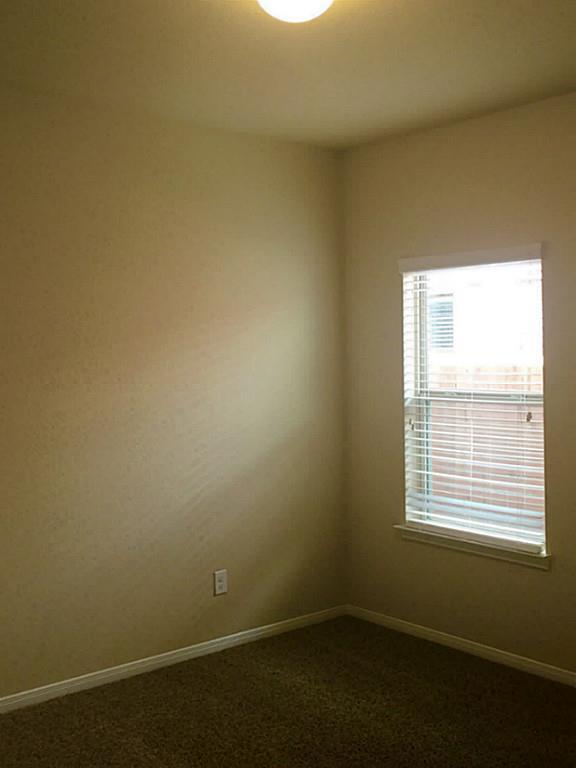 618 Longstreet Drive Rosenberg, TX 77469 - Photo 19 of 23 an empty room with a window