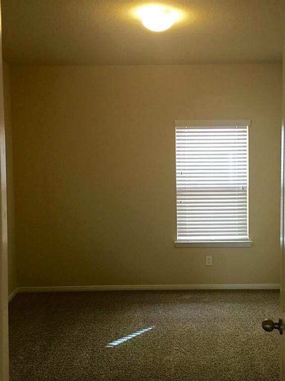 618 Longstreet Drive Rosenberg, TX 77469 - Photo 20 of 23 a view of an empty room with a window