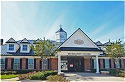 618 Longstreet Drive Rosenberg, TX 77469 - Photo 21 of 23 a view of a large building with a clock on the wall