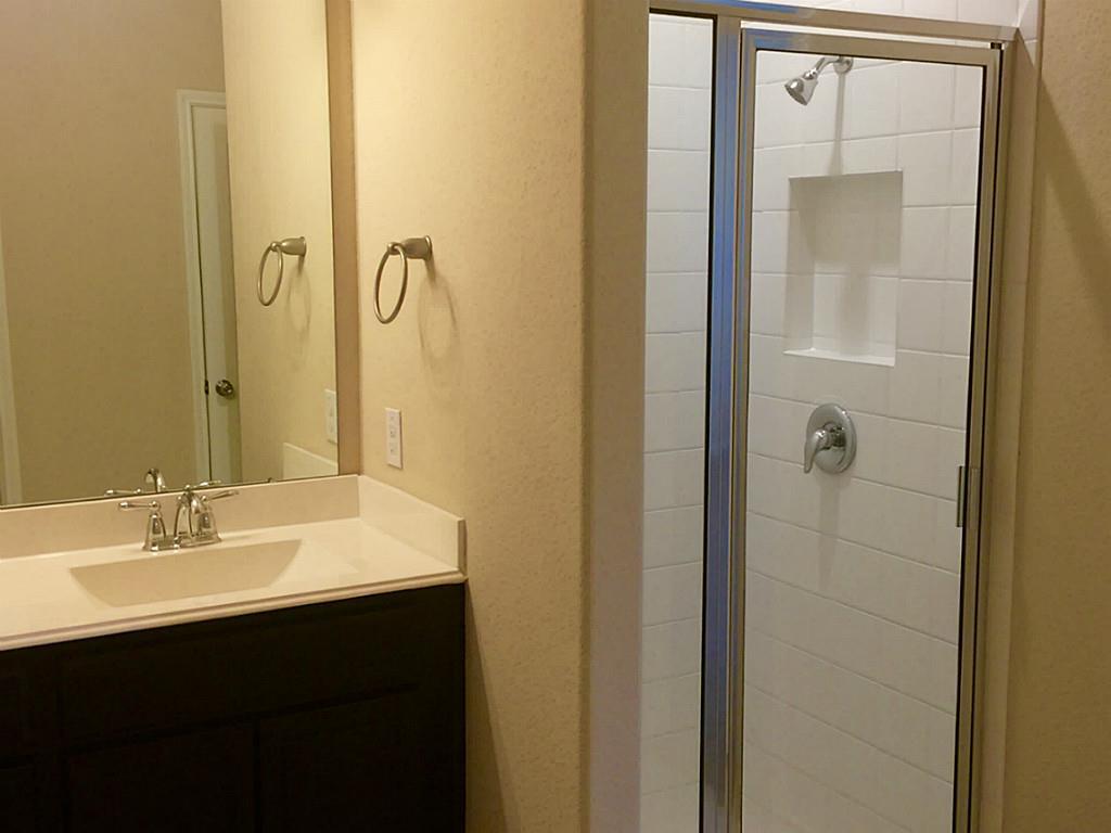 618 Longstreet Drive Rosenberg, TX 77469 - Photo 9 of 23 a bathroom with a sink and mirror