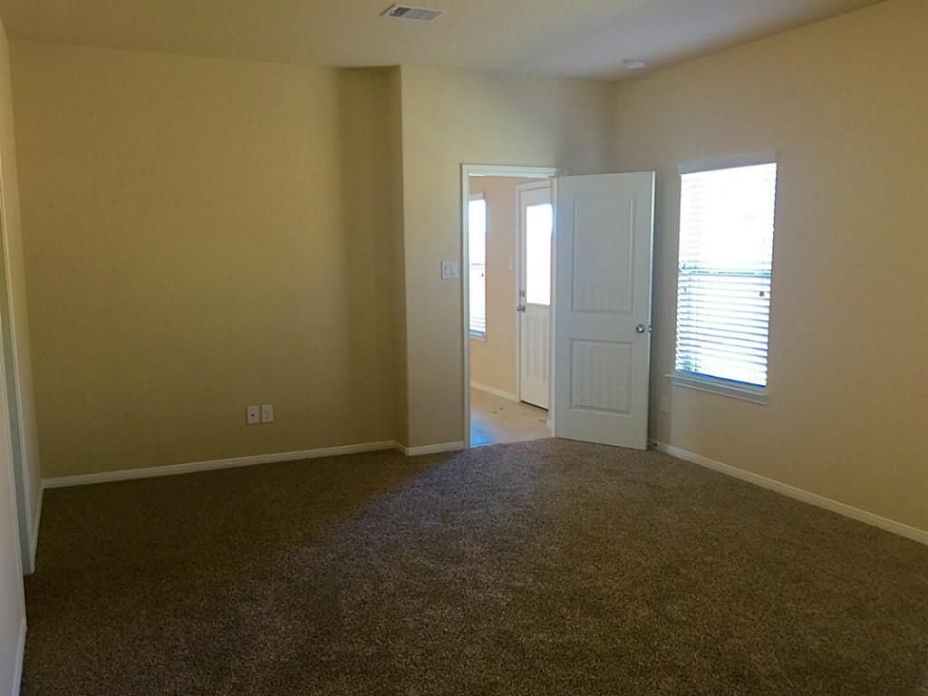 618 Longstreet Drive Rosenberg, TX 77469 - Photo 10 of 23 an empty room with windows