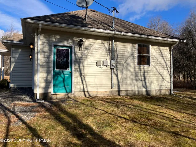 a view of a house with a wooden door