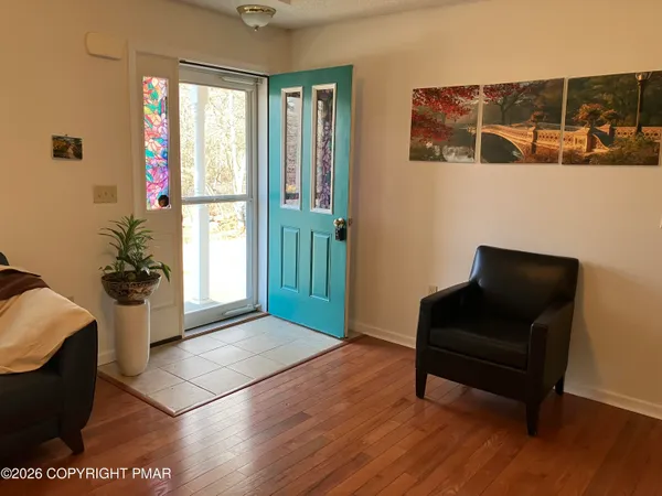 a living room with furniture and a window