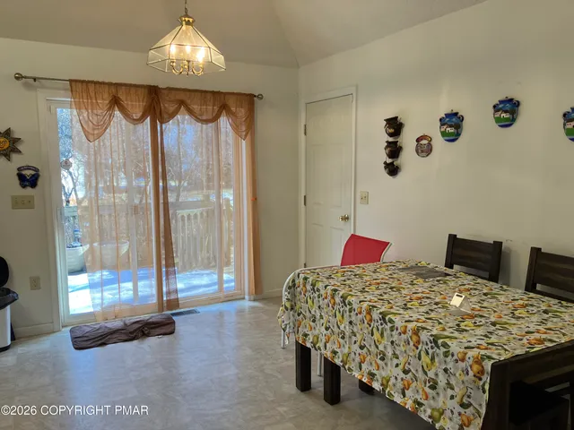 a bedroom with a bed and glass window