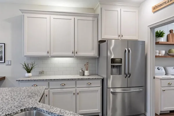 a kitchen with a stove and a sink