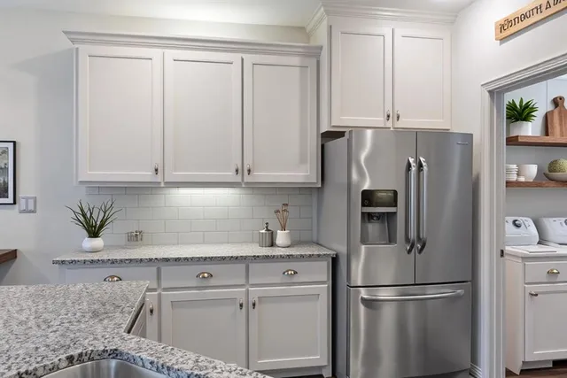 a kitchen with a stove and a sink