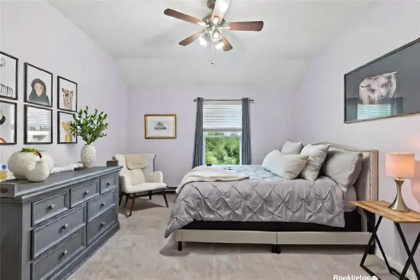 a bathroom with a double vanity sink a toilet and a mirror