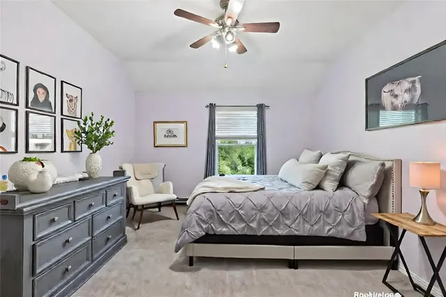 a bathroom with a double vanity sink a toilet and a mirror