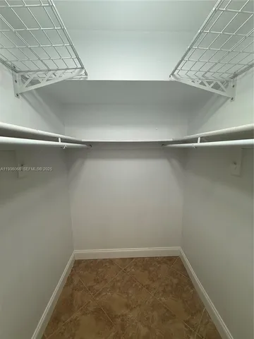 a view of a room with shelf on the wall