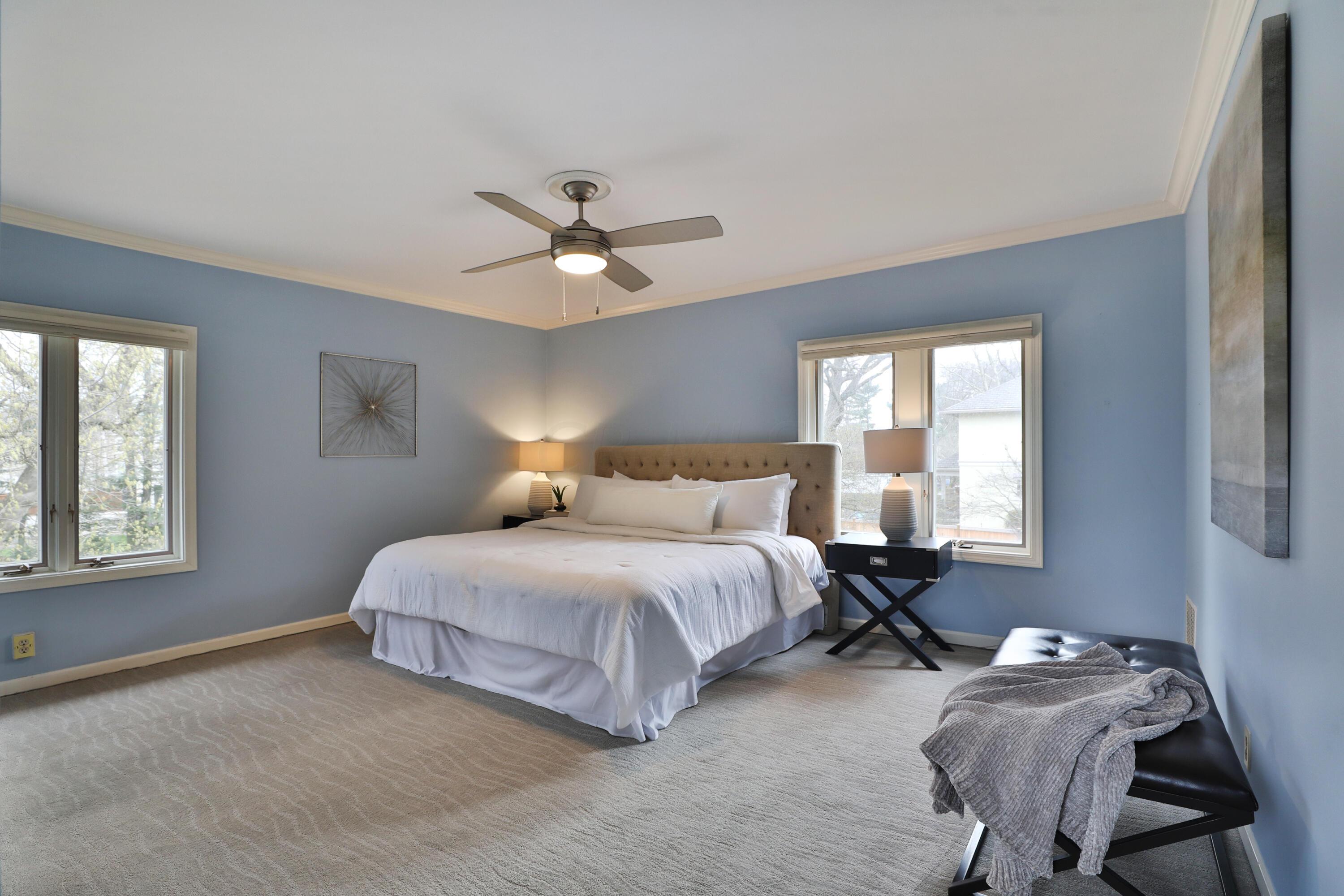2180 Bryden Road Columbus, OH 43209 - Photo 39 of 56 New carpeting, overhead ceiling fan/light, large windows. Blue walls.